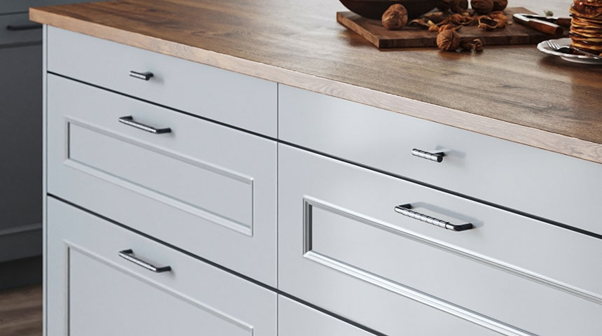 Bamboo knobs, handles and hooks installed in kitchen cabinets and hallway
